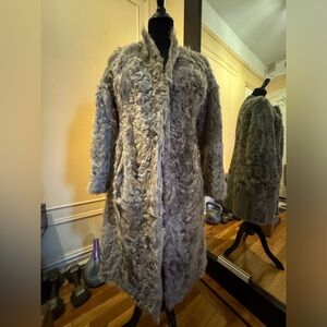 Real fur. Warm and fashionable coat for winter. Sheep fur and leather.